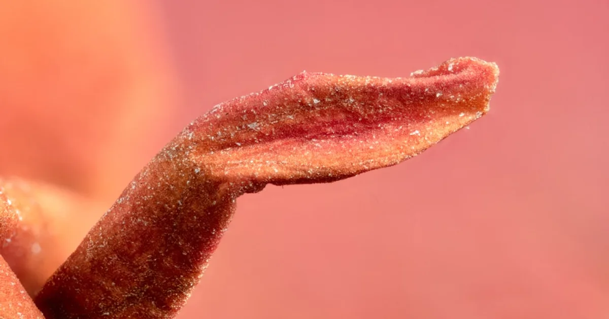 a close up of a person's lip and tongue